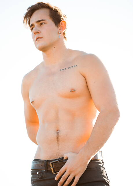 American muscular Josh Brady undressing and showing tight butt outside