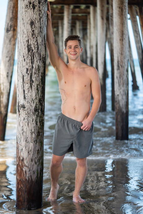 Muscular Robbie and strongman Clyde in hot homosexual action on the beach